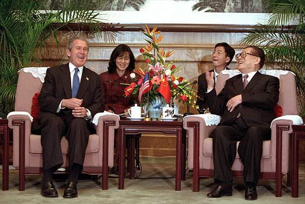 President George W. Bush and Chinese President Jiang Zemin talk during an arrival ceremony at The Great Hall of the People in Beijing, People's Republic of China, Feb. 21. White House photo by Paul Morse.