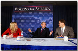 President George W. Bush participates in a roundtable discussion on corporate responsibility at America II Electronics in St. Petersburg, Florida, Friday, March 8, 2002. Also pictured at right, CEO of America II Electronics Michael Galinski, and employee Sarah Wood. White House photo by Eric Draper.
