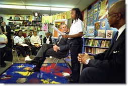 President George W. Bush listens to students read about American values during a visit to Vandenberg Elementary School in Southfield, Mich., Monday, May 6. White House photo by Tina Hager.