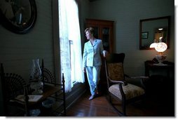 Laura Bush walks through the home of author Katherine Anne Porter in Kyle, Texas, June 13, 2002.  White House photo by Tina Hager