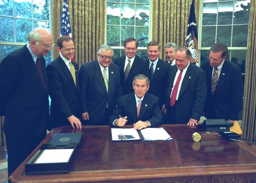 President George W. Bush signs the Export-Import Bank Reauthorization Act in the Oval Office June 14, 2002. 