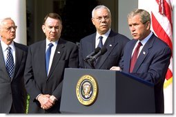 President George W. Bush announces a new Mother and Child HIV Prevention Initiative in the Rose Garden June 19. Standing by the President from, left to right, are Secretary of Treasury Paul O'Neill, Secretary of Health and Human Services Tommy Thompson and Secretary of State Colin Powell. "Today I announce that my administration plans to make $500 million available to prevent mother-to-child transmission of HIV," said the President. "This new effort, which will be funded during the next 16 months, will allow us to treat one million women annually, and reduce mother-to-child transmission by 40 percent within five years or less in target countries. White House photo by Tina Hager.