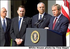 President George W. Bush announces a new Mother and Child HIV Prevention Initiative in the Rose Garden June 19. Standing by the President from, left to right, are Secretary of Treasury Paul O'Neill, Secretary of Health and Human Services Tommy Thompson and Secretary of State Colin Powell.