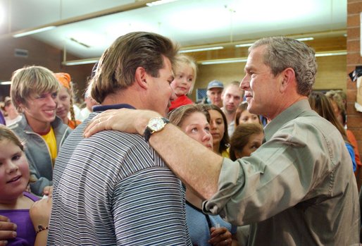 President George W. Bush greets familes displaced by the Arizona forest fires at Round Valley High School in Eagar, Ariz., Tuesday, June 25. White House photo by Eric Draper.