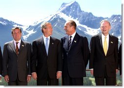 President George W. Bush and other G8 leaders pose for photographers during the photo session at the G8 Summit in Alberta, Canada, June 26. Pictured the President from left are German Chancellor Gerhard Schroeder, French President Jacques Chirac and Canadian Prime Minister Jean Chretien. White House photo by Eric Draper.