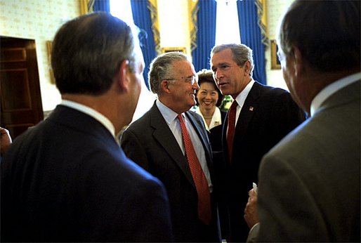 Before the signing ceremony of the Sarbanes-Oxley Act, President George W. Bush meets with Sen. Paul Sarbanes, D-Md., Secretary of Labor Elaine Chao and other dignitaries in the Blue Room at the White House July 30. 