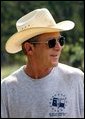 President George W. Bush takes a break during work at his ranch in Crawford, Texas, Friday, Aug. 9, 2002. White House photo by Eric Draper.