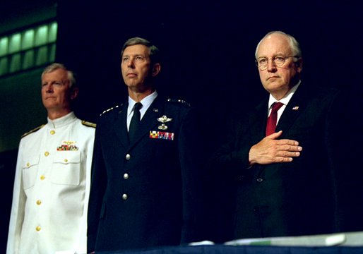 Vice President Dick Cheney Vice stands at attention with Vice Admiral John Totushek, left, and General Donald Cook, center, during the National Anthem moments before addressing veterans of the Korean War in San Antonio, TX Aug. 29, 2002. 