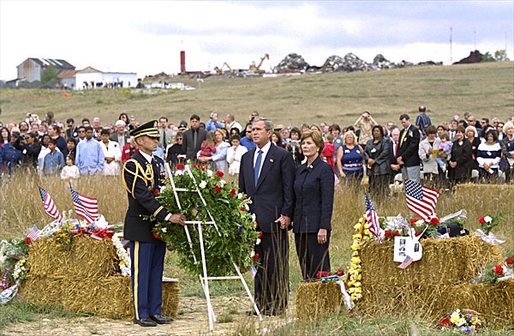President George W. Bush and Mrs. Laura Bush participate in a wreath-laying ceremony near the site of the crash where seven crew members and 33 passengers died when the plane crashed in Somerset County. Officials believe the plane was heading for a target in Washington, D.C., when the passengers fought back against the four hijackers. White House photo by Tina Hager.