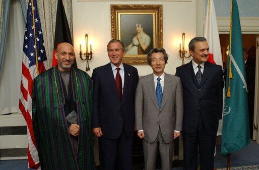 President George W. Bush poses for a group photo with, from left, President of Afghanistan Hamid Karzai, Japanese Prime Minister Junichiro Koizumi and Saudi Arabian Foreign Minister Prince Saud al-Faisal at the Waldorf-Astoria Hotel in New York City, Thursday, Sept. 12, 2002. The leaders announced a joint project to provide $180 million for road improvements in Afghanistan. White House photo by Eric Draper.