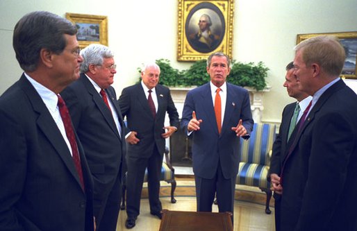 President George W. Bush along with Vice President Dick Cheney talk with Congressional Leaders Wednesday, Sept. 18, 2002, in the Oval Office. White House photo by Eric Draper.