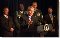 President George W. Bush highlights humanitarian efforts in Afghanistan during remarks about U.S. Humanitarian Aid to Afghanistan, Friday, October 11, 2002 at the Presidential Hall in the Dwight David Eisenhower Executive Office Building. "More than 2 million Afghan refugees have returned back to the country since November. That is a positive sign. It's a good sign that people are sensing their country is a better place to live and more secure, a better place to raise a family," President Bush said. White House photo by Tina Hager.