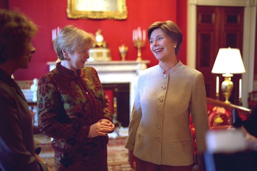 Laura Bush shares a light moment with Ludmila Putina, wife of Russian Federation President Vladimir Putin, in the Red Room of the White House Saturday, October 12, 2002 prior to the opening ceremony of the Second Annual National Book Festival. White House photo by Susan Sterner.