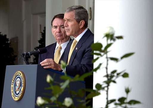 President George W. Bush announces the administration's new rule on generic drugs in the Rose Garden Monday, Oct. 21. Standing with the President is Secretary of Health and Human Services Tommy Thompson. "By this action, we will reduce the cost of prescription drugs in America by billions of dollars and ease a financial burden for many citizens, especially our seniors," explained the President. White House photo by Tina Hager.