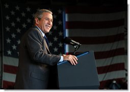 President George W. Bush reacts to the crowd during the Tennessee Welcome at the Tri-City Aviation in Blountville, Tennessee, Saturday, Nov.2, 2002.  White House photo by Eric Draper