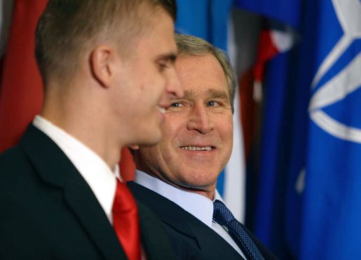 President George W. Bush looks toward Gedrimas "Jimmy" Jaglinskas before being introduced by the West Point Cadet at a speech to the Prague Atlantic Student Summit in Prague, Czech Republic, Wednesday, Nov. 20. White House photo by Paul Morse.
