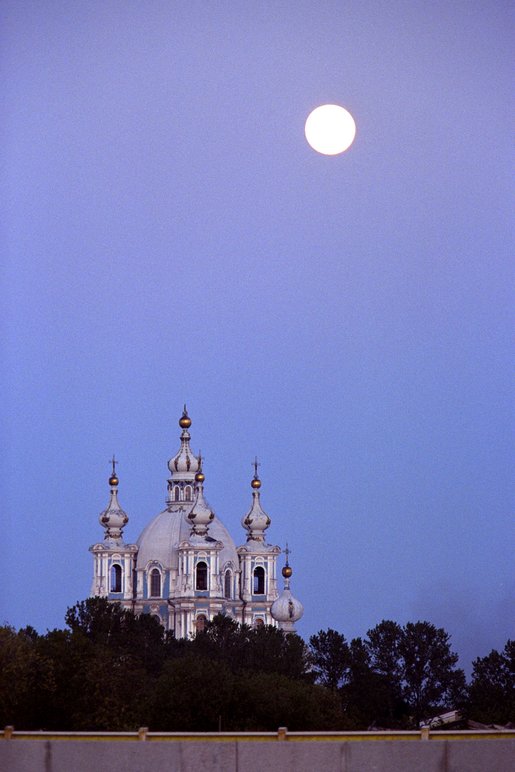 The moon rises at sunset in St. Petersburg, Russia. White House photo by Paul Morse