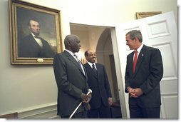 President George W. Bush welcomes President Daniel arap Moi of Kenya, left, and Prime Minister Meles Zenawi of Ethiopia to the Oval Office Dec. 5. "We welcome two strong friends of America here; two leaders of countries which have joined us in the -- to fight the global war on terror; two steadfast allies, two people that the American people can count on when it comes to winning the first war of the 21st century," said President Bush during their meeting in the Cabinet Room.  White House photo by Eric Draper
