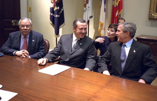 President George W. Bush meets with Recep Tayyip Erdogan, Chairman of Turkey's AK Party during National Security Advisor Dr. Condoleezza Rice's meeting in the Roosevelt Room, Tuesday, Dec. 10, 2002. Also pictured is Secretary of State Colin Powell. "We join you, side by side, in your desire to become a member of the European Union. We appreciate your friendship in NATO. You're a strategic ally and friend of the United States, and we look forward to working with you to keep the peace, " said President Bush during the brief meeting. White House photo by Paul Morse