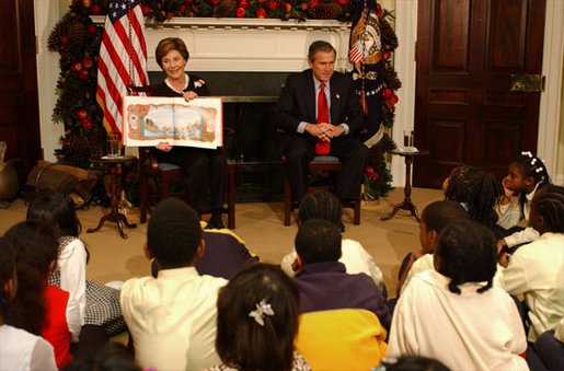 President George W. Bush and Laura Bush read "'Twas the Night Before Christmas," to a class of third-graders during the White House Story Hour in the Roosevelt Room Tuesday, Dec. 17. White House photo by Tina Hager.
