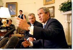 President George W. Bush and Polish President Aleksander Kwasniewski meet with the media in the Oval Office Jan. 14, 2003.  White House photo by Paul Morse