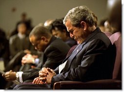 President George W. Bush prays during a church service honoring Dr. Martin Luther King, Jr. at the First Baptist Church of Glenarden in Landover, Md., Jan. 20, 2003. "It is fitting that we honor this great American in a church because, out of the church comes the notion of equality and justice," said the President in his remarks.  White House photo by Eric Draper