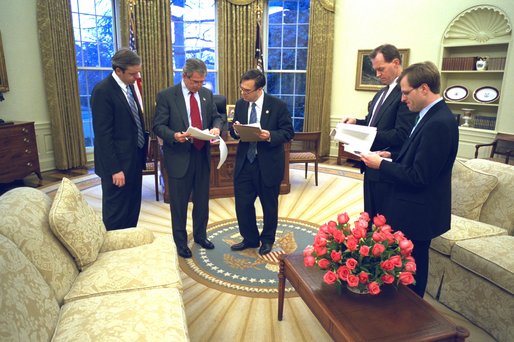 President George W. Bush prepares his State of the Union speech with Dan Bartlett, White House Communications Director, at left,  Mike Gerson, director of Presidential Speechwriting, and speech writers Matthew Scully and John McConnell in the Oval Office Thursday, January 23, 2003. White House photo by Eric Draper