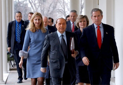President George W. Bush and Italian Prime Minister Silvio Berlusconi walk along the colonnade after holding a joint press conference in the Oval Office Thursday, Jan. 30, 2003. White House photo by Tina Hager.