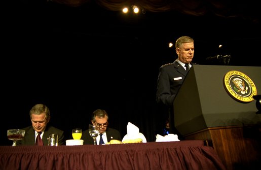 Led in prayer by the Chairman of the Joint Chiefs of Staff General Richard Myers, President George W. Bush and Congressman Ray LaHood (R-IL) pray during the National Prayer Breakfast in Washington, D.C., Thursday, Feb. 6, 2003. "In this hour of our country's history, we stand in the need of prayer. We pray for the families that have known recent loss. We pray for the men and women who serve around the world to defend our freedom," said the President in his remarks. "We pray for their families. We pray for wisdom to know and do what is right. And we pray for God's peace in the affairs of men." White House photo by Eric Draper.
