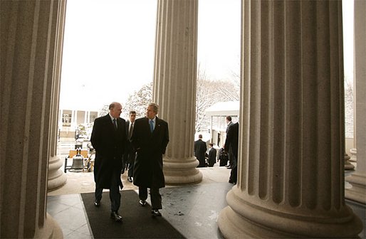 John Snow, the newly appointed Secretary of Treasury, walks with President George W. Bush to his swearing-in ceremony at The Treasury Building Friday, Feb. 7, 2003. White House photo by Paul Morse