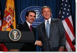 President George W. Bush and President Jose Maria Aznar of Spain shake hands at the end a joint press conference at the Bush Ranch in Crawford, Texas, Saturday, Feb. 22, 2003.  White House photo by Eric Draper