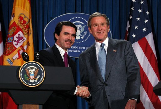 President George W. Bush and President Jose Maria Aznar of Spain shake hands at the end a joint press conference at the Bush Ranch in Crawford, Texas, Saturday, Feb. 22, 2003. White House photo by Eric Draper.