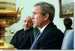 President George W. Bush and President Hamid Karzai of Afghanistan answer questions from the press after a meeting in the Oval Office Thursday, Feb. 27, 2003.  White House photo by Tina Hager