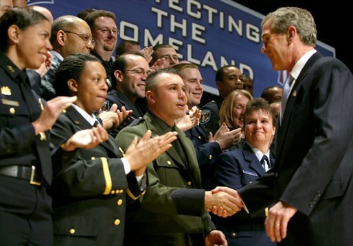 After speaking, President George W. Bush greets a few of the new employees at the U.S. Department of Homeland Security at the Ronald Reagan Building and International Trade Center in Washington, D.C., Friday, Feb. 28, 2003. White House photo by Paul Morse