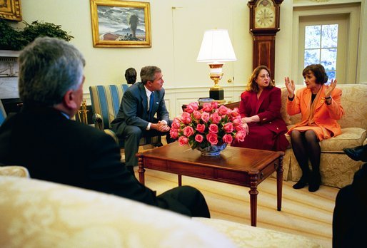 President George W. Bush listens to Dr. Katrin Michael, at right, Della Jaff and Idres Hawarry, foreground, in the Oval Office Friday, March 14, 2003. The three are from the Kurdish area of Iraq where a chemical weapons attack killed 5,000 citizens 15 years ago this weekend. Thousands died in the days following the attack on Halabja and an estimated 10,000 people still suffer from the attack. Idres Hawarry survived the attack on Halabja, Dr. Michael survived a similar attack in another Kurdish village and friends and family of Della Jaff were killed in Halabja. White House photo by Eric Draper.
