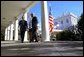 President George W. Bush and Secretary of State Colin Powell walk back to the Oval Office after addressing the media in the Rose Garden Friday, March 14, 2003. The President discussed an outline for peace in the Middle East. White House photo by Paul Morse.