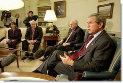 President George W. Bush talks with the press during a meeting with congressional leaders in the Oval Office Friday, March 21, 2003. Pictured with the President are, from left, House Minority Leader Nancy Pelosi, D-Calif., Speaker of the House Dennis Hastert, R-Ill., and Vice President Dick Cheney.   White House photo by Paul Morse