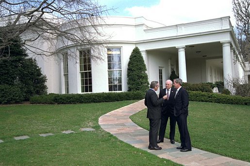 President George W. Bush meets with Vice President Dick Cheney and Secretary of Defense Donald Rumsfeld outside the Oval Office shortly after authorizing operation "Iraqi Freedom" Wednesday morning, March 19, 2003. White House photo by Eric Draper