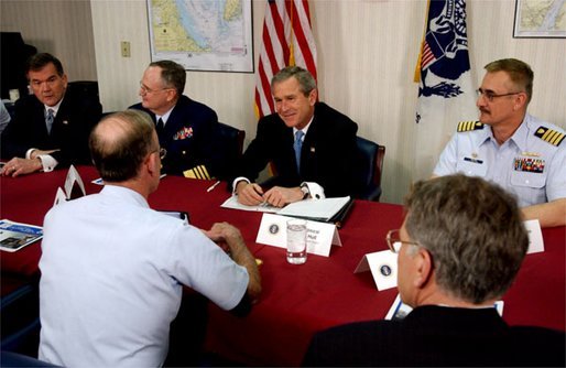 President George W. Bush and Secretary of Homeland Security Tom Ridge, far right, meet with U. S. Coast Guard officers during their visit to the port in Philadelphia Monday, March, 31, 2003. White House photo by Tina Hager.