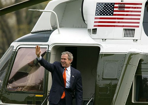 President George W. Bush waves as he departs for Camp David from the South Lawn Friday, April 4, 2003. White House photo by Paul Morse.
