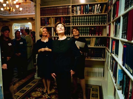 Laura Bush tours the Dwight D. Eisenhower Executive Office Building Library after launching the Executive Office of the President Virtual Library Tuesday, April 8, 2003. "This library is a valuable center of knowledge within the White House. Since it opened 125 years ago, the library has grown from a small reference collection to a modern research facility, with a strong concentration in American history and government," Mrs. Bush said. "Launching the EOP Virtual Library today is a perfect start to National Library Week. This week is not only a celebration of our nation's libraries, but of the people who make them great." White House photo by Susan Sterner