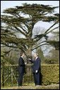 President George W. Bush and British Prime Minister Tony Blair talk alone in the gardens of Hillsborough Castle near Belfast, Northern Ireland, Tuesday, April 8, 2003. White House photo by Paul Morse