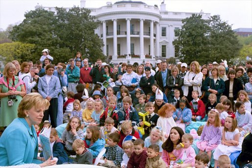Lynne Cheney reads from her book, "America: A Patriotic Primer," at the White House Easter Egg Roll Monday, April 21, 2003. Accompanying Mrs. Cheney, several Cabinet members and authors also read to children during the day. White House photo by Susan Sterner