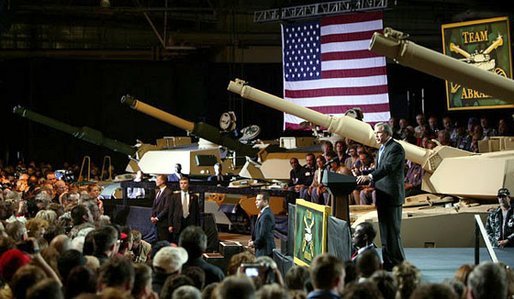 President George W. Bush addresses employees of the Lima Army Tank Plant, where the Abrams M1A2 tank is built, in Lima, Ohio, April 24, 2003. "I'm here to thank you all for your service to our country, and thank you for the vital contribution you have made to peace and freedom," said the President in his remarks. "And each of you have had a part in this mission. Each of you are a part to making sure this country is strong enough to keep the peace." White House photo by Paul Morse