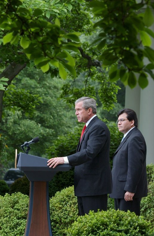 As Counsel Judge Alberto Gonzales stands by his side, President George W. Bush delivers remarks regarding his judicial nominations in the Rose Garden Friday, May 9, 2003. White House photo by Tina Hager.