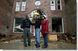 President George W. Bush comforts Scott and Annette Rector in front of their destroyed business in Pierce City, Mo., Tuesday, May 13, 2003. "You can't realize what it's like to see a tornado go right down the main street of a town and just wipe it out," said President Bush as he surveyed the damage from tornados that ripped through southwestern Missouri May 4. "It's hard to envision. But a lot of people know you're suffering, and a lot of people are praying for you, and a lot of people care for you. And a lot of people wish you all the best."  White House photo by Susan Sterner
