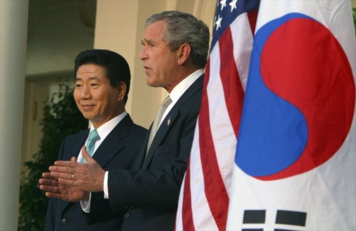 President George W. Bush and South Korean President Roh Moo-hyun in the Rose Garden on May 14, 2003. White House photo by Paul Morse.