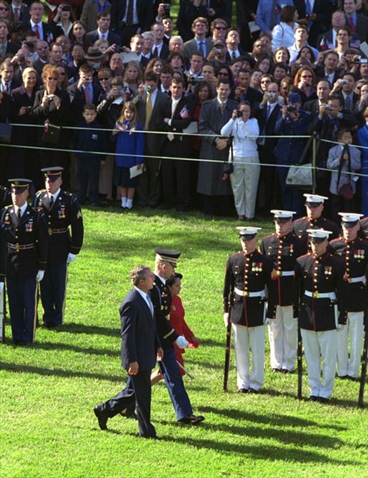 President George W. Bush and President Arroyo review the troops. White House photo by Paul Morse