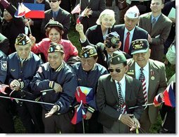 World War II Filipino-American veterans cheer for Presidents Bush and Arroyo. "I am proud of the contributions that Filipinos and Filipino Americans make to the American economy and society," said President Arroyo in her remarks. "In a quiet, but equally substantive way, we can compare it to the contribution made by Philippine World War II veterans to the defense of our common freedom and security."   White House photo by Tina Hager
