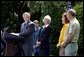 President George W. Bush discusses his plan for wildfire prevention and forest stewardship, the Healthy Forests Initiative, in The East Garden Tuesday, May 20, 2003. Standing on stage with the President are, from left, Agriculture Secretary Veneman, Interior Secretary Gale Norton, Fire Management Officer Andrea Gilham and Wildlife and Fire Staff Officer Rex Mann. White House photo by Susan Sterner